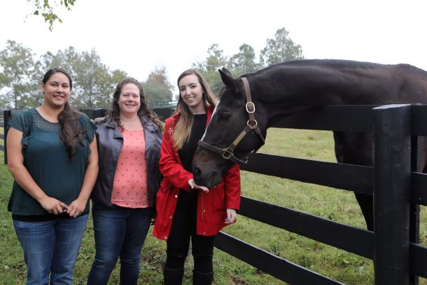 Sweepstakes winner Jackie Camacho and her guest Allison pose for a photo with Zenyatta and NYRA representative Breanne. Photo courtesy of NYRA.